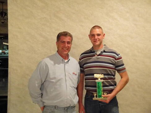 matt manoli  with driver joe buckley recieving an award
