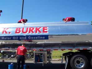 Fire fighter working the controls of a refueling truck