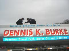 Two firefighters on top of a Dennis K. Burke refueling truck training