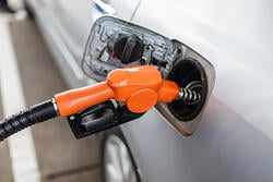 Fuel pump filling up a commuter car