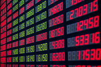 Stock market numbers on a digital board