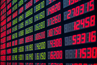 Stock market numbers on a digital display board