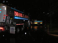 Dennis K. Burke refueling truck performing an emergency refueling at night