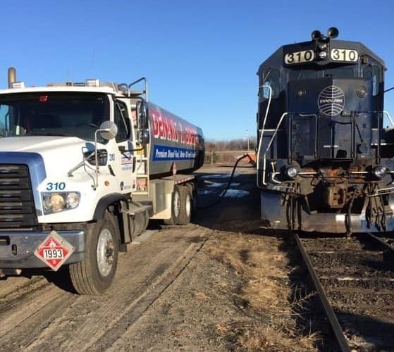 Image of a Dennis K Burke truck fueling a diesel locomotive