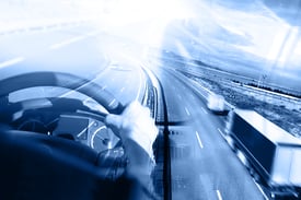 Abstract view of the cockpit of a semi-truck driving on the highway