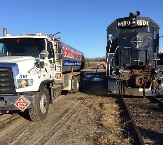 Image of a Dennis K Burke truck fueling a diesel locomotive