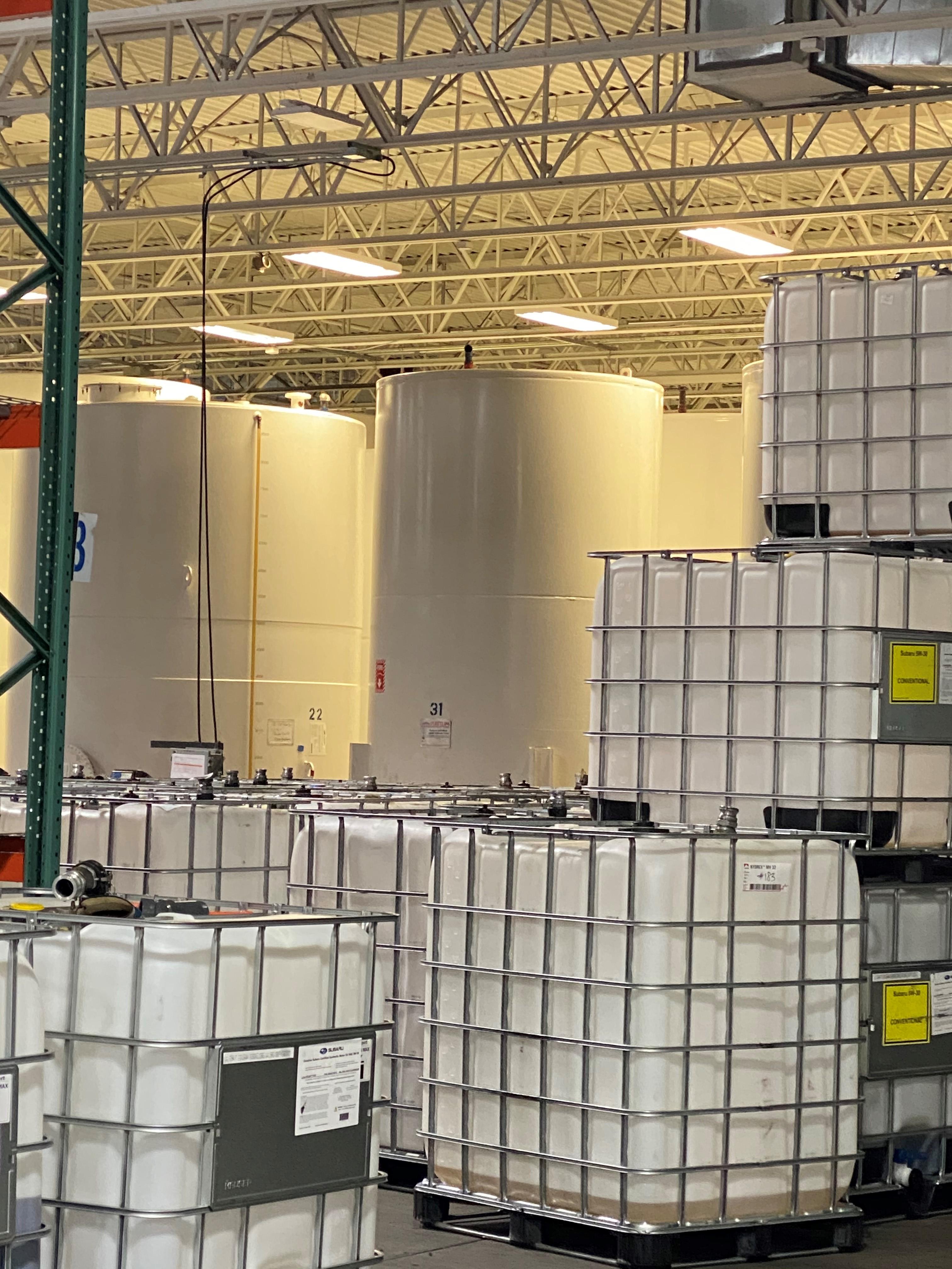 DEF totes with bulk tanks in background
