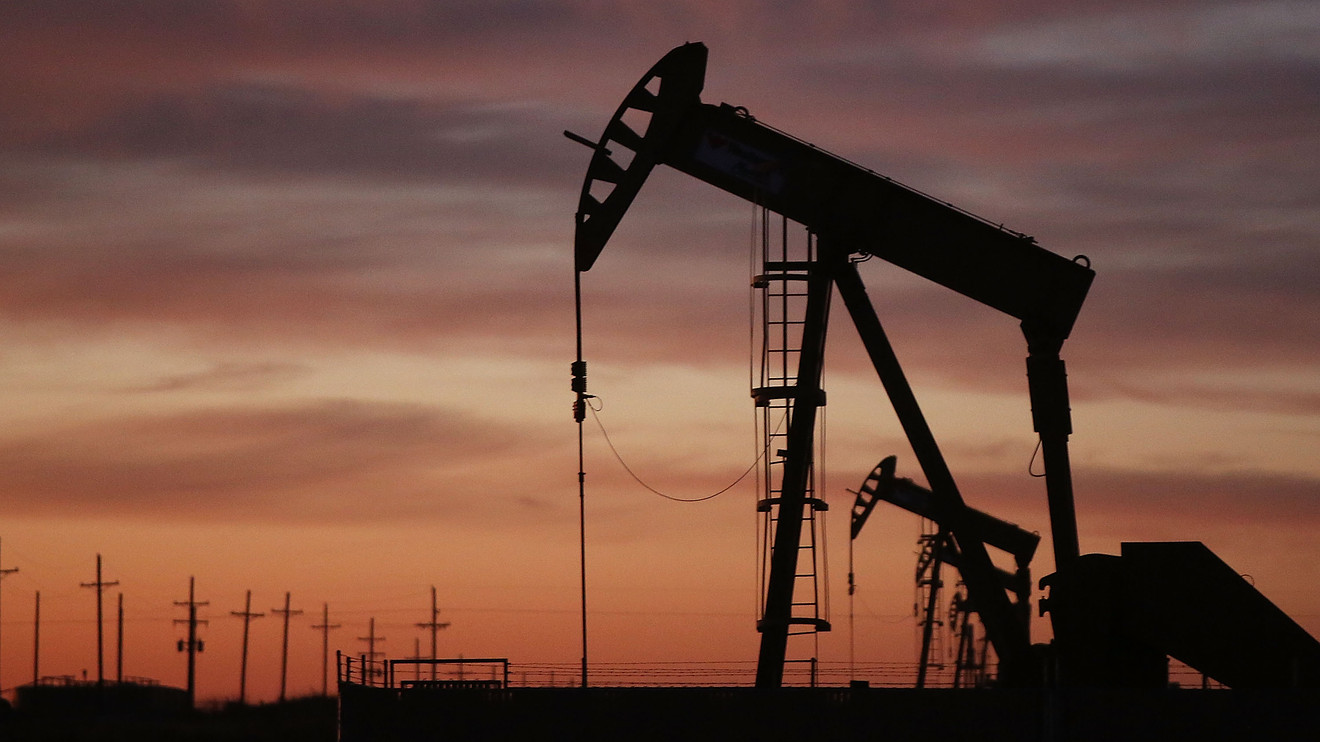 image of an oil rig working ahead of sunset